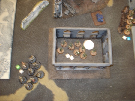 Chasing them out! That white poker chip is the sewer more enemy troops popped out of!